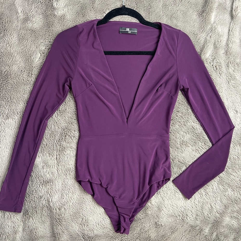 Worn once. Purple Bodysuit long sleeve, size Small